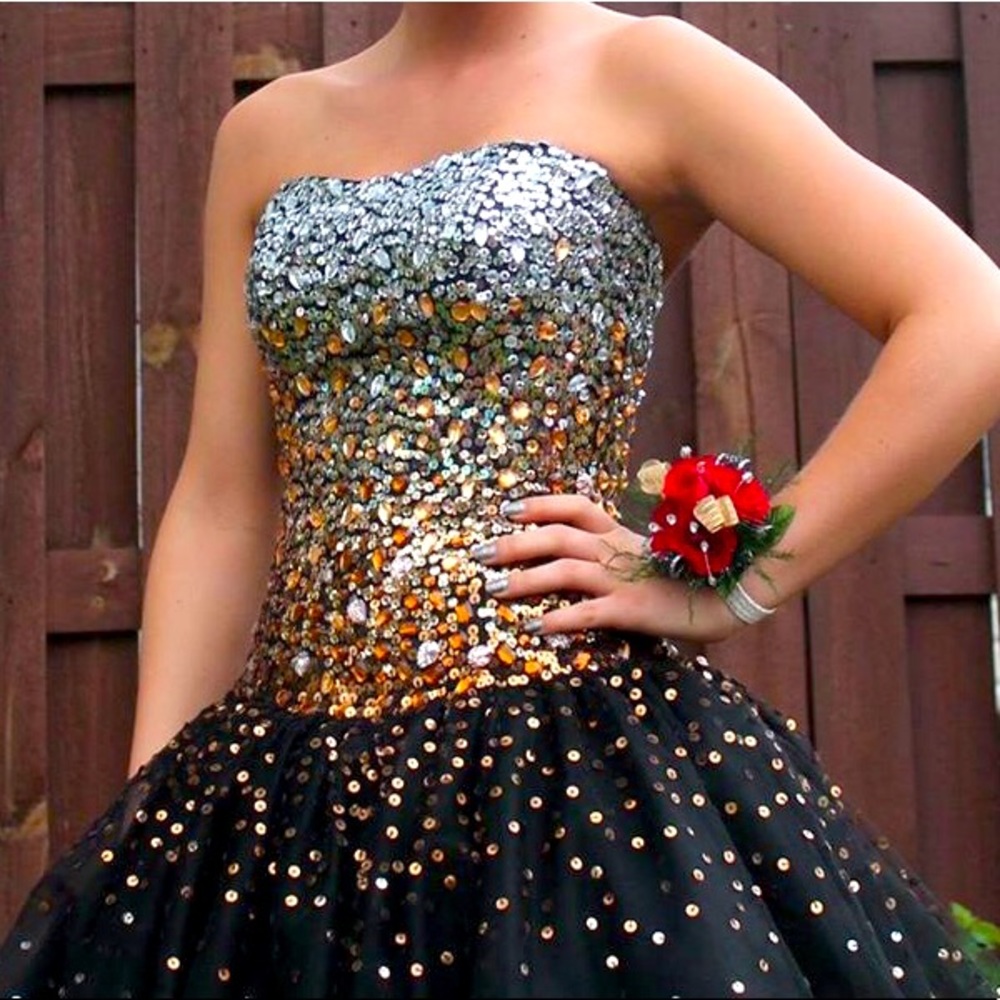 Black ball gown prom dress with silver and gold accents. Worn once. Size 2-4